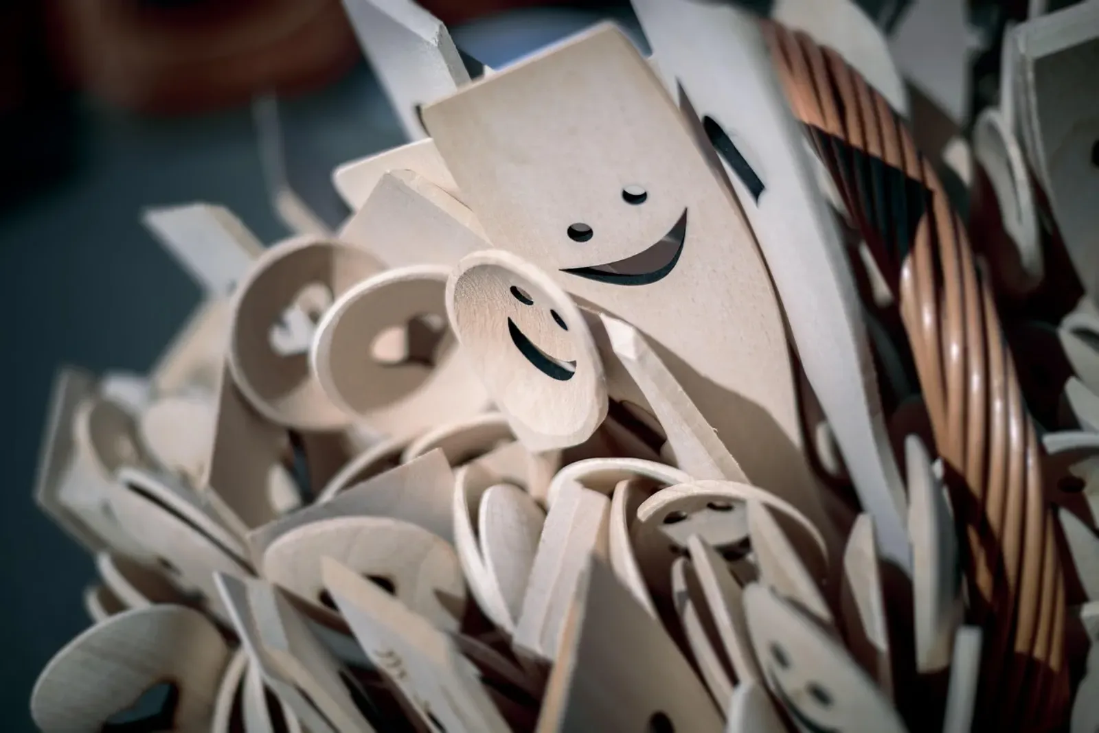 Close detail of plain white household utensils on a light surface