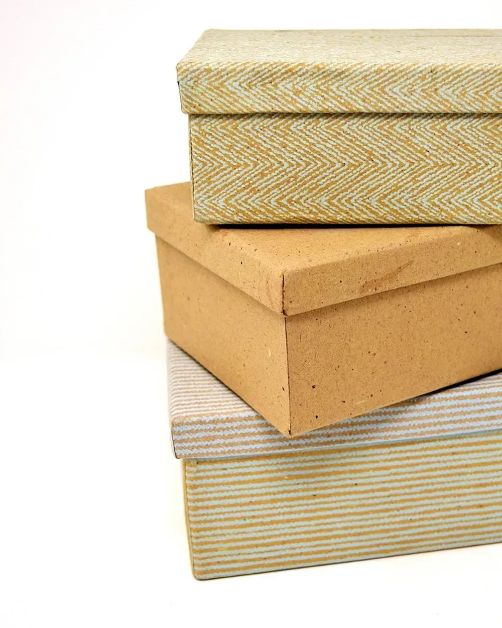 A neat stack of plain product boxes on a light background